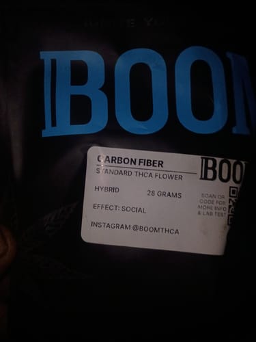 Close-up of the customer's black bag of Carbon Fiber, showing the white label with product information.