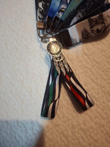 Customer's First In, Last Out Hero Bracelet, featuring a striped design and a silver charm.