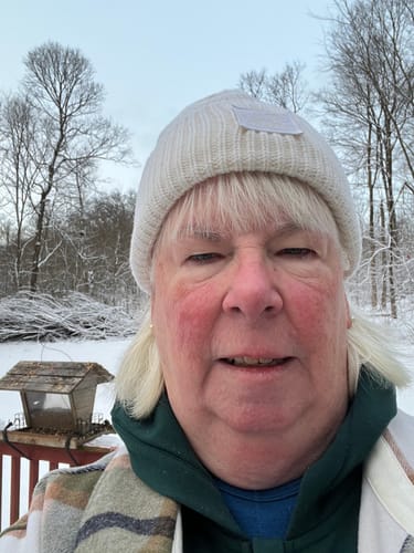 Reviewer wearing the Ria Chunky Beanie in Buttercream outdoors in the snow.