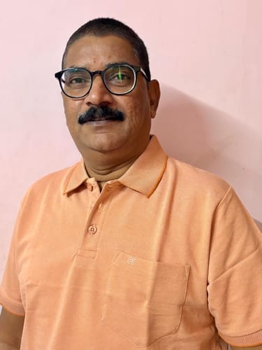 Close-up of a customer wearing the orange Golf Polo shirt.