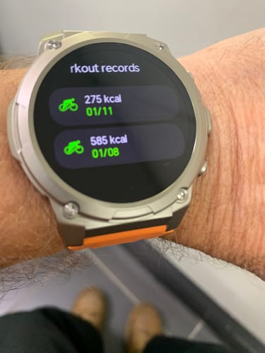 Customer wearing the rugged Gard Pro Ultra 3 watch, with workout records for cycling displayed on the screen.