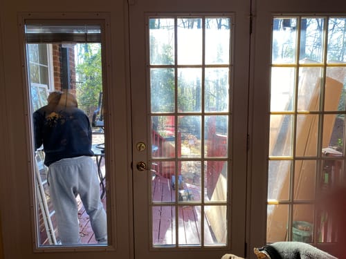 Customer showing the process of installing the Raise & Lower Blinds Glass Kit on one of three doors with old gridded glass.