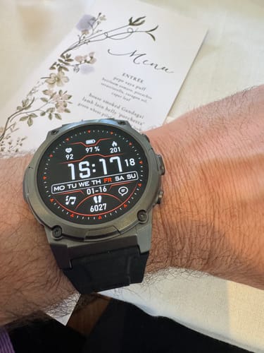 Reviewer wearing the Gard Pro Ultra 3 smartwatch on their wrist at a wedding, showing the detailed digital display.