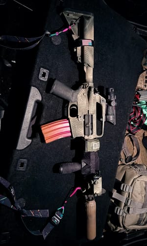 Customer's customized rifle, showing black Raid Tape wrapped on the foregrip and stock for utility.