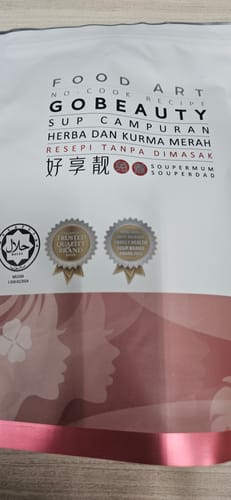 A customer's photo of the white and pink packaging for their Go Beauty herbal soup.