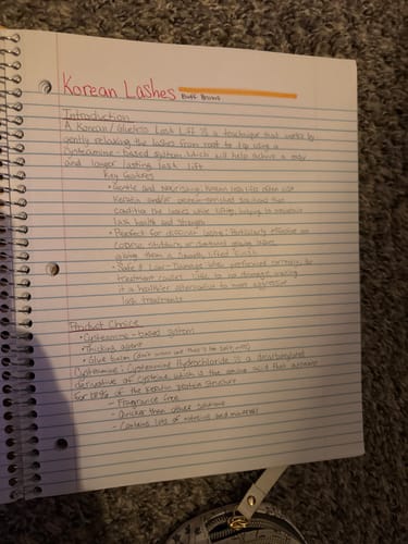 Customer's handwritten notes about the Korean Lash Lift course in a spiral notebook.