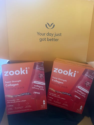 Customer's two red boxes of Zooki Collagen Super Strength Variety Pack inside a yellow shipping box.