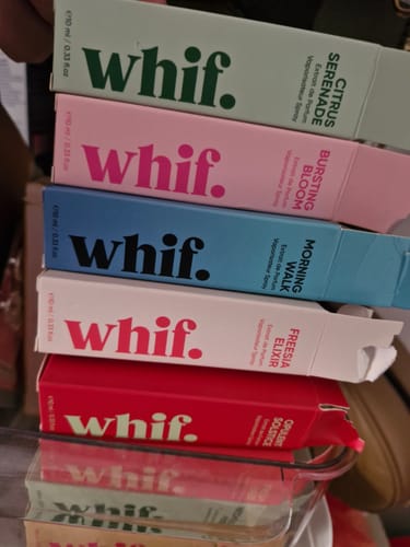 Customer's collection of whif. fragrances, with the green Citrus Serenade box on top of a colorful stack.