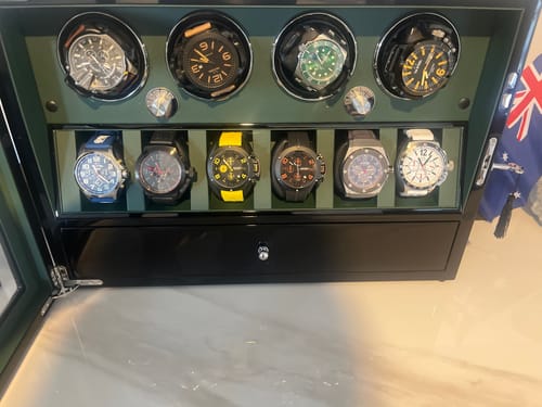 Customer's collection of Lucky Fours® Chronograph watches displayed in a black watch winder box.
