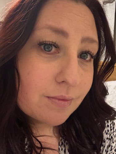 Customer selfie showing her full, curly Delicate Desire - DD Curl Length lashes after five days of wear.