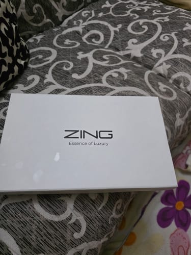 Customer's Winter Box, showing the white gift box on a patterned surface.