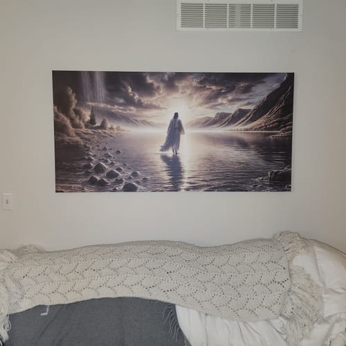 Customer's Tailored Boost canvas print depicting a religious scene, hanging on a wall above a bed.