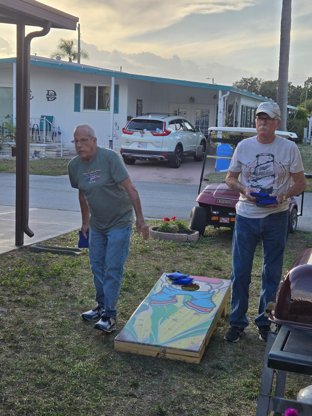 Customer photo review of (Kiss My Ass) - Cornhole Board Wrap - Set of 2