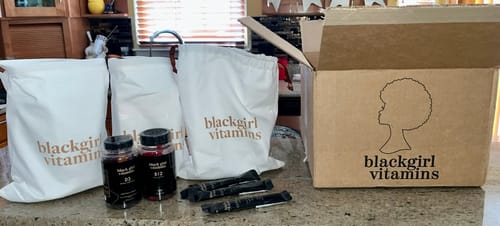 Customer's BGV Collagen Powder sachets and vitamin bottles from their order, shown with branded bags and the shipping box.
