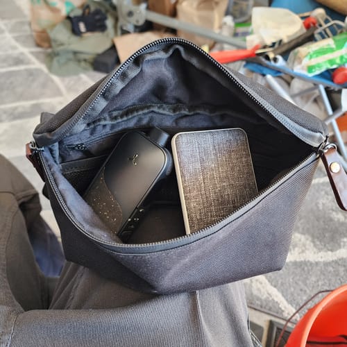 Reviewer's black Legacy PRO 2 vaporizer visible inside an open travel bag.