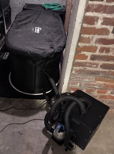 Customer's Pod Chiller connected to a covered ice bath pod in an indoor setting.