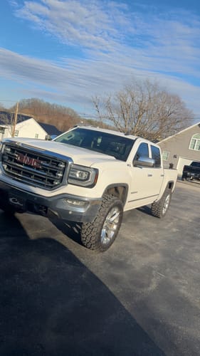 Customer's white GMC Sierra with a wider stance after installing the Hubcentric Wheel Spacers.