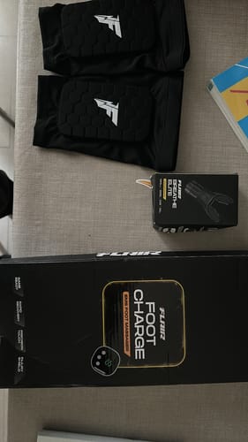 Reviewer's order laid out, showing the footcharge packaging next to shin guards and a Breathe Elite box.