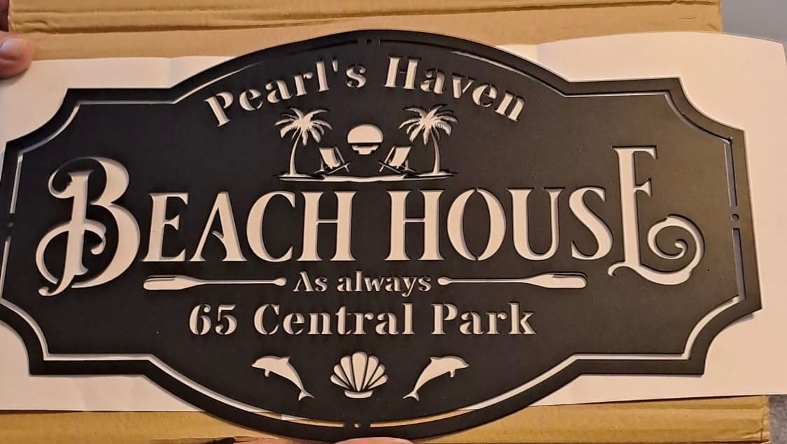Customer photo review of Beach House Metal Sign