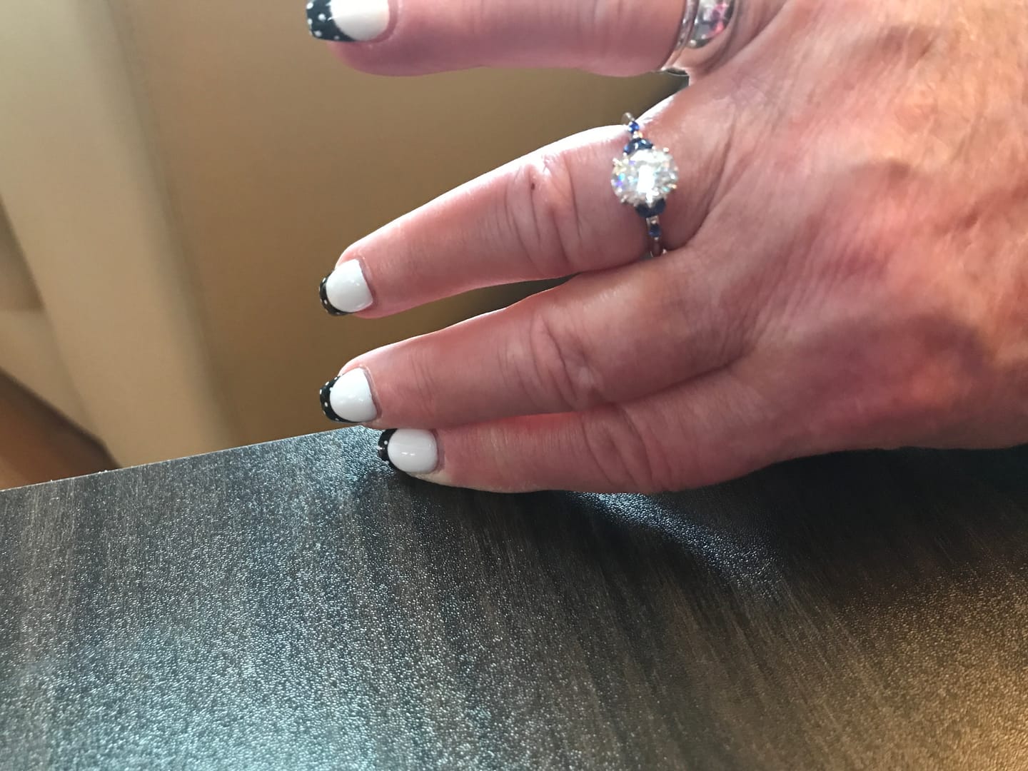 Customer photo review of Oval Cut Moissanite With Marquise Sapphire Petals Accents Engagement Ring