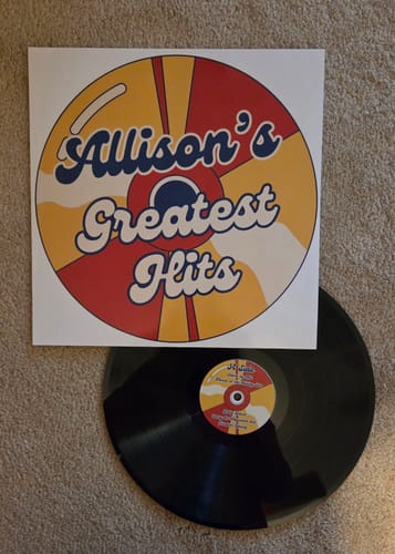 Customer's Custom Vinyl Record with its personalized sleeve titled 'Allison's Greatest Hits' in a retro design.
