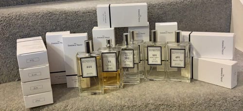 Customer's Inspired by Rose Prick - 11 bottle shown with their large fragrance collection and white boxes.