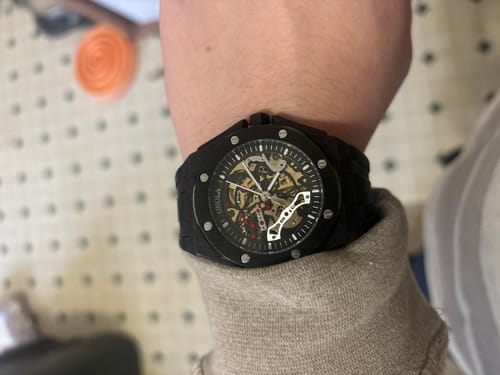 Reviewer wearing the black Lucky Fours® Prince Oak skeleton watch on their wrist.