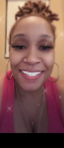 Reviewer smiling in a close-up photo, showing their new Pop On Veneers.
