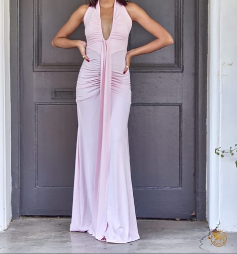 Reviewer posing in the light pink Plunge Neck Evening Maxi Dress, showing its deep neckline and full-length design.