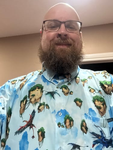 Customer wearing the light blue Avatar 'Hallelujah Mountains' shirt showing the pattern of floating islands.