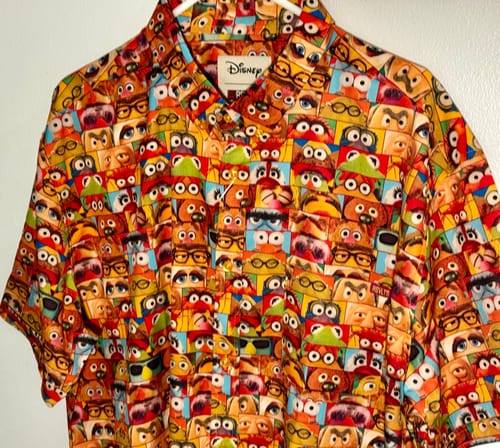 Customer's close-up of the colorful 'Muppet Vision' shirt, showcasing the detailed pattern of various Muppet eyes.
