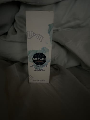 Customer's Meraki Blu Methylene Blue box standing on a rumpled surface.