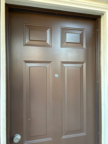 Customer's brown door viewed from inside, now sealed with the installed magnetic weatherstrip.