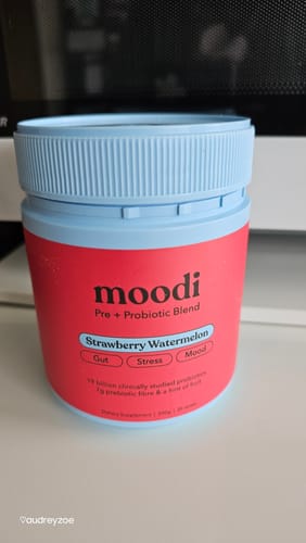 Customer's Moodi Strawberry Watermelon Pre + Probiotic Blend in a red and blue jar on a white surface.