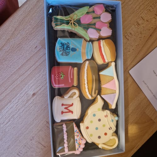 Customer's Afternoon Tea Deluxe Biscuit Box showing the colorful, beautifully decorated biscuits in tea-themed shapes.