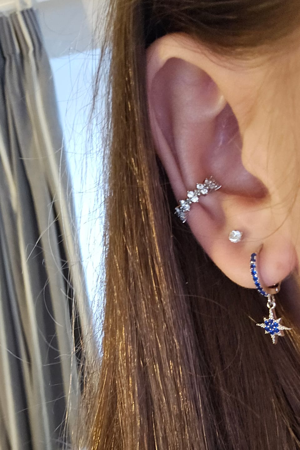 Customer photo review of Cosima Blue Silver Star Huggie Earrings