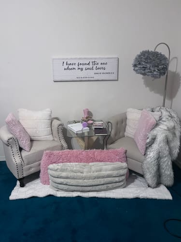 Customer's 'I Have Found The One' rustic sign hung on the wall of a cozy living room.