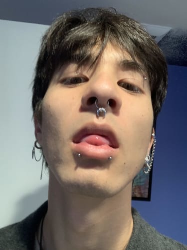 Close-up of a reviewer wearing the 10mm Faux Luna Septum, showing the moon charm.