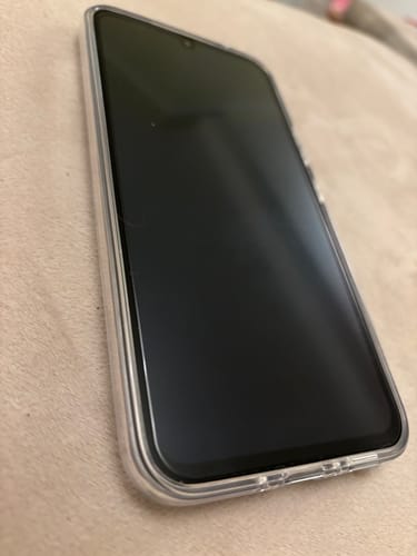 Reviewer's refurbished Samsung Galaxy A34 5G in a clear case, highlighting its pristine condition.