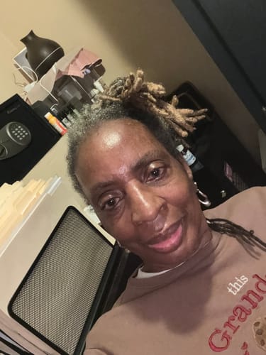 Customer smiling, feeling the improved energy and mood from taking Nektar® Superfood.