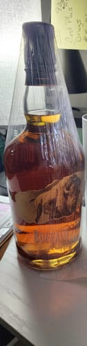 Customer's bottle of Buffalo Trace Bourbon Whiskey, carefully wrapped in clear plastic for delivery.