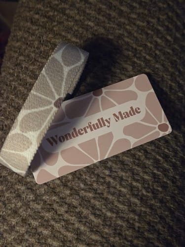 A customer's Wonderfully Made Bible Verse Bracelet shown next to its matching 'Wonderfully Made' card.