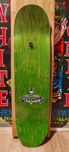 Customer's view of the top of the Forbidden skateboard, showing its green wood grain finish and logo.