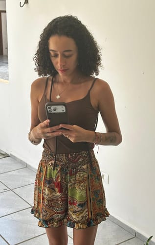 Avaliação com foto de um cliente sobre Nora | Marrom Café