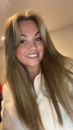 Customer smiling while wearing the Lazy Girl Pre-Glued Half Lashes.