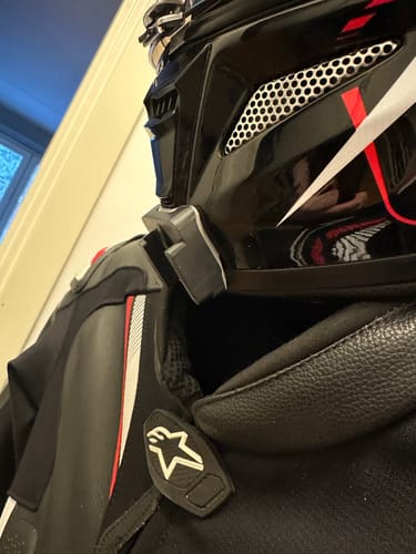 Customer's black HJC RPHA-11 Camera Mount showing a snug fit on the chin of a motorcycle helmet.