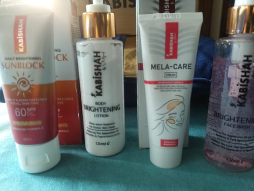 Customer's Special Pigmentation Bundle products: sunblock, body lotion, Mela-Care cream, and brightening face wash.