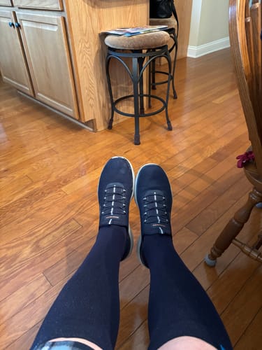 Customer's first-person view of their dark Performance Eucalyptus Compression Socks and sneakers.