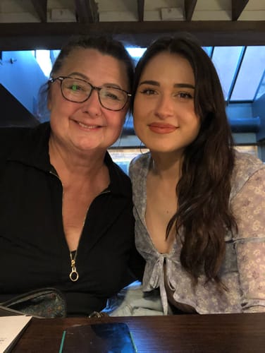 Reviewer smiling with the person who introduced her to F-Balm.