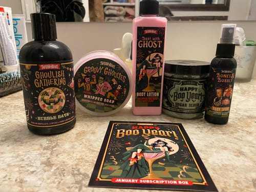 Reviewer's complete January Monthly Subscription Box products arranged on a bathroom counter.